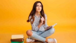 portrait-pensive-young-girl-making-notes
