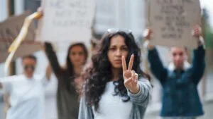 showing-gesture-by-two-fingers-group-feminist-women-have-protest-their-rights-outdoors