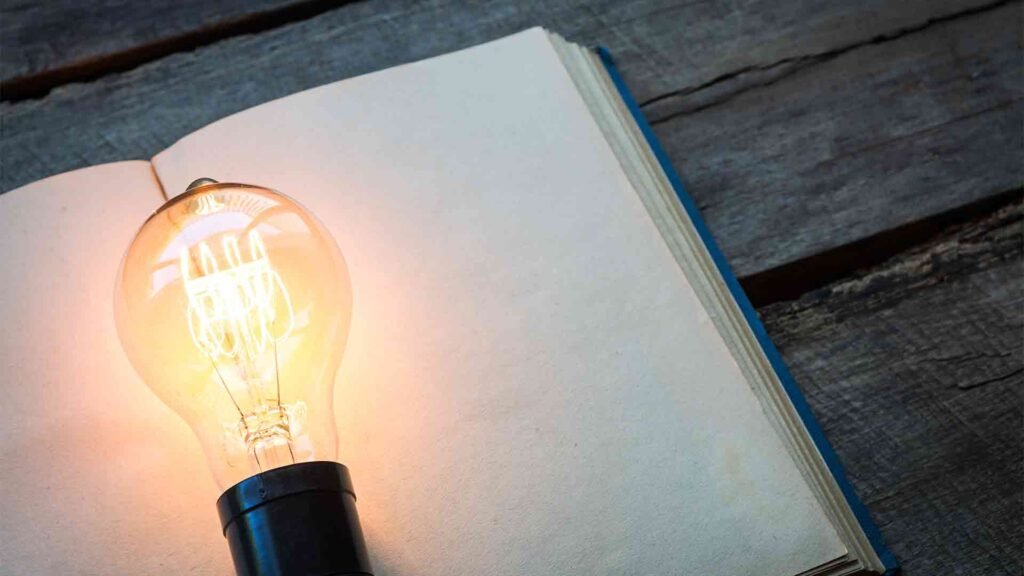 vintage-book-light-bulb-wood-table