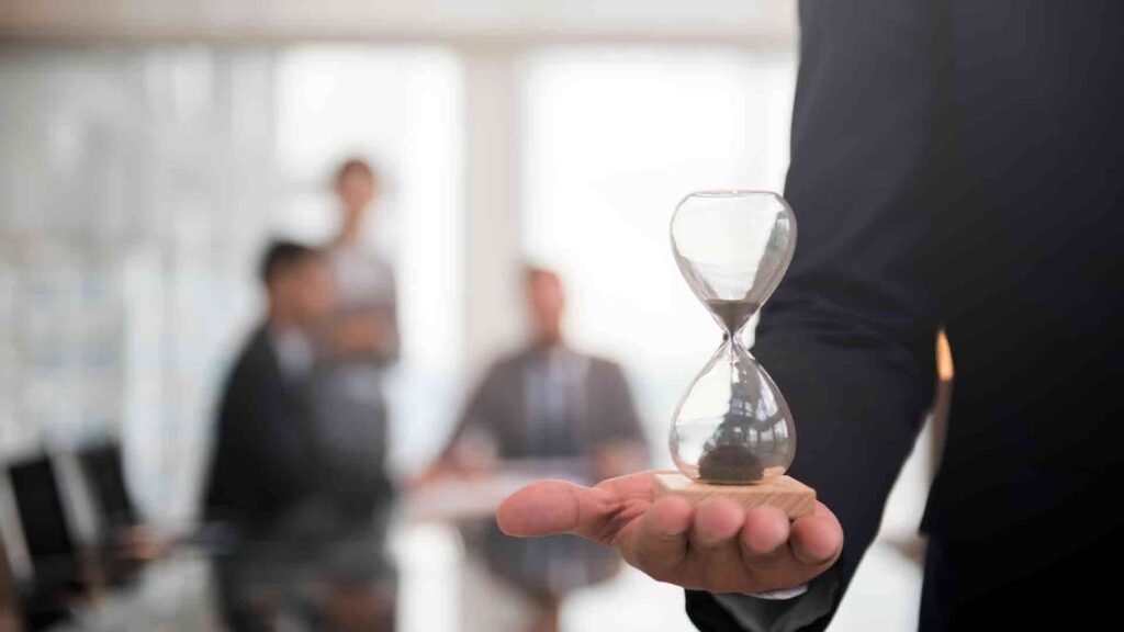 businessman-holding-hour-glass-signifies-importance-being-time
