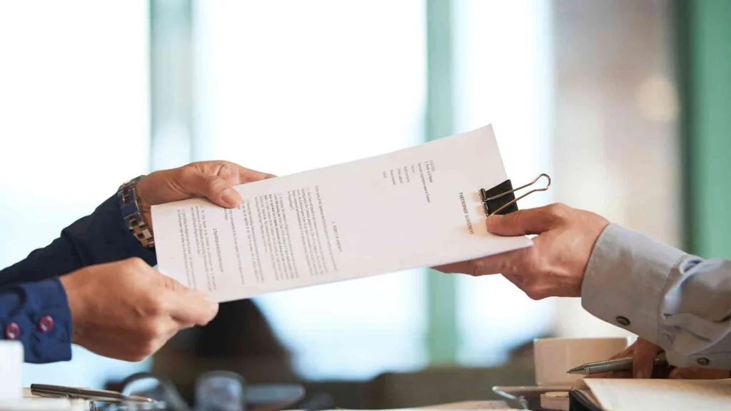 closeup-hands-passing-contract-unrecognizable-businessman