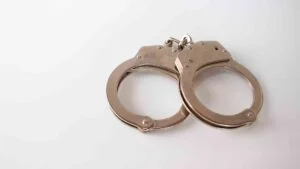 high-angle-shot-metal-handcuffs-isolated