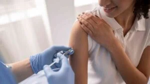 doctor-vaccinating-patient-clinic