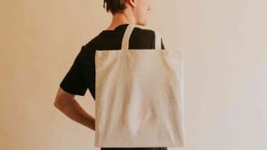 back-view-man-carrying-tote-bag