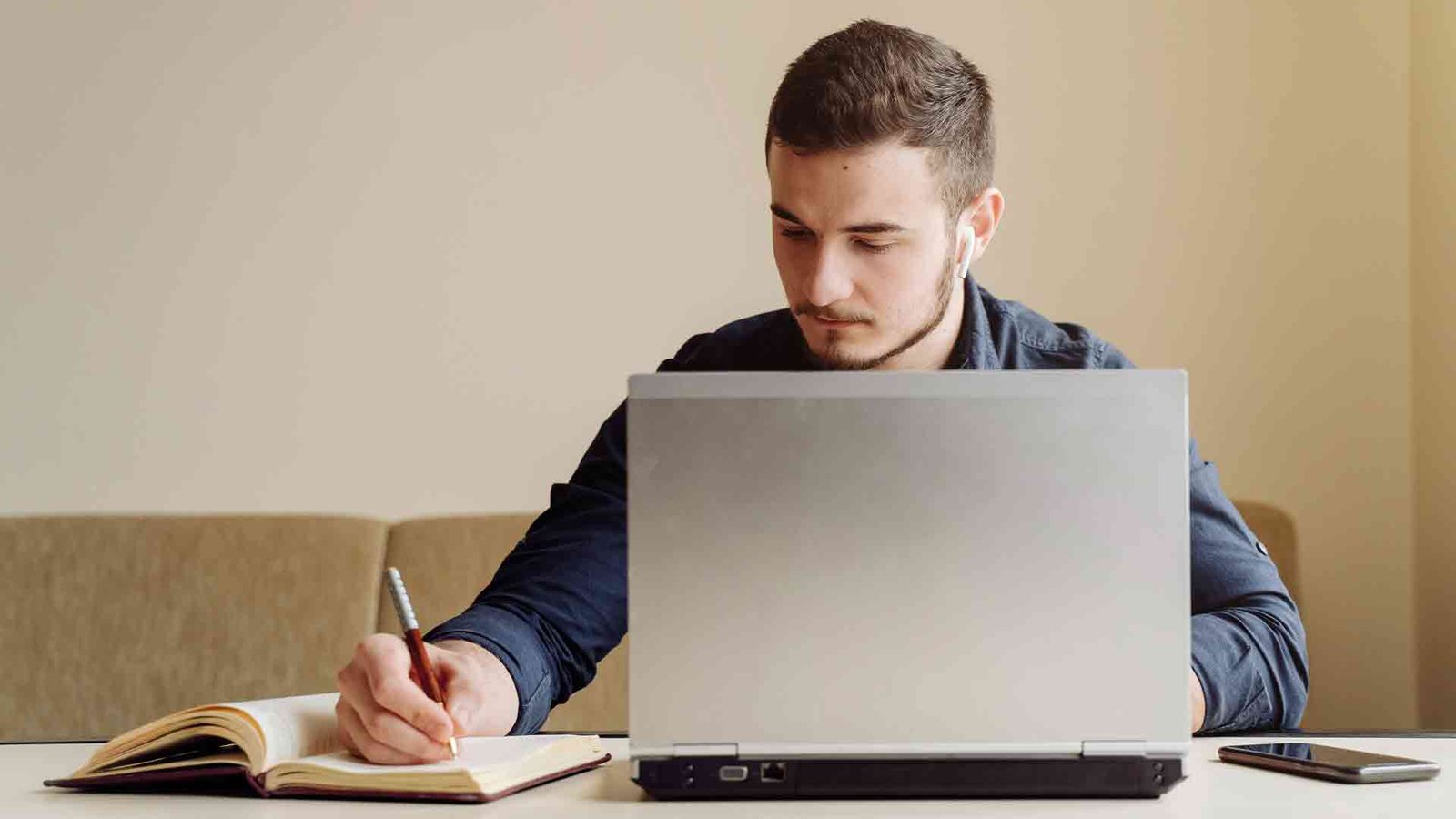 young-businessman-working-with-computer-remotely