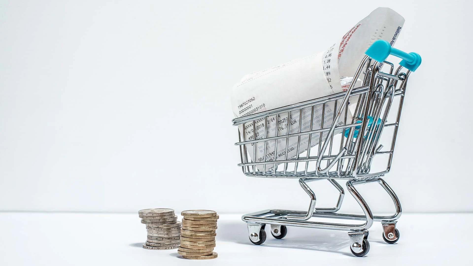 shopping-cart-with-purchased-receipt-euro-coins